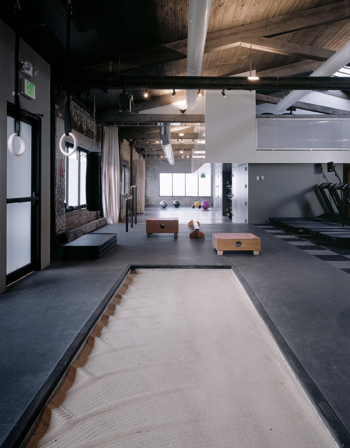 ZUM fitness interior showing coordinated architectural finishes and materials