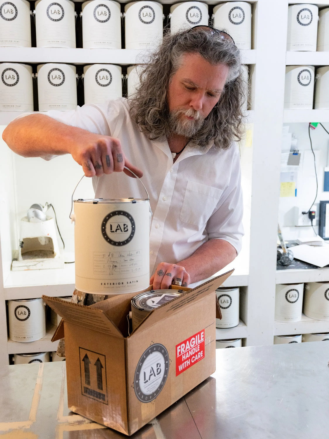The Paint Laboratory packing a paint order for shipment